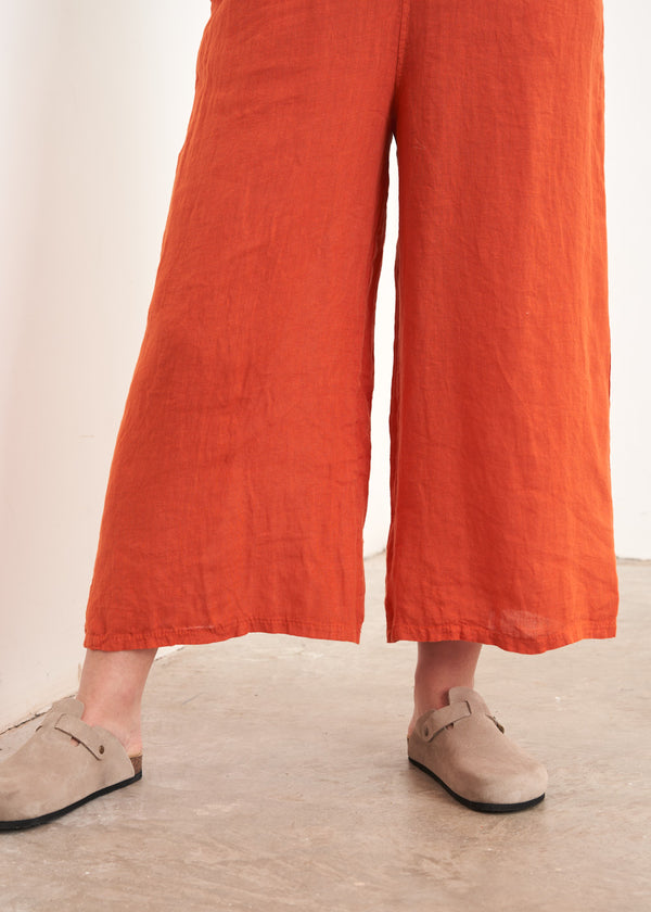 Red cropped linen trousers